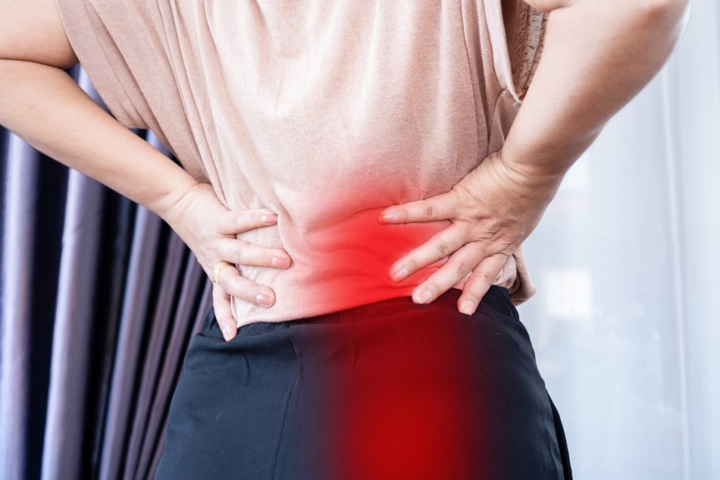 closeup woman suffering from buttocks and lower back pain, Sciatica Pain concept